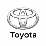 Toyota logo: silver oval emblem with intersecting ellipses and the word Toyota beneath.